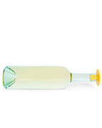 A clear glass wine bottle with a pale yellow tint and a yellow lion Whine Stopper, shown horizontally on a plain white background.
