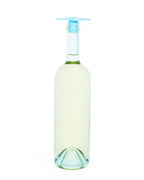 A clear glass wine bottle with a light blue silicone Whine Stopper, shown against a solid white background.